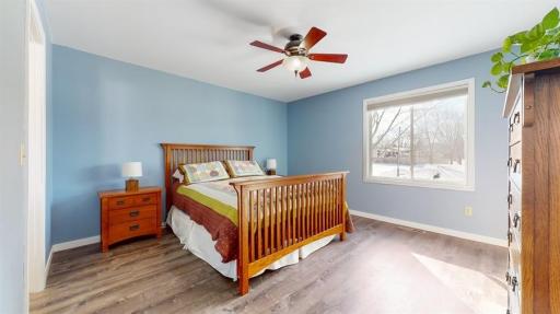 Upper level primary bedroom features a walk in closet and full walk through bathroom.