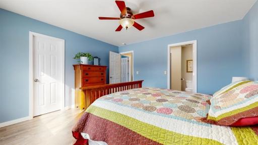 Upper level primary bedroom features a walk in closet and full walk through bathroom.