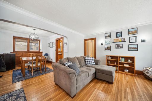 Living and dining room connected with beautiful hardwood floors