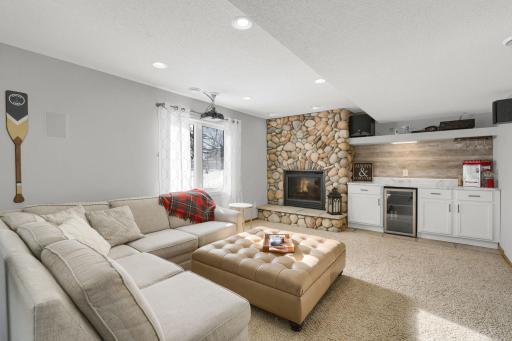 Lower level family room with gas fireplace and projector