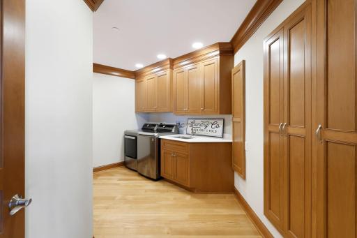 Laundry with lots of cabinetry and counterspace