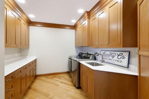 Laundry with lots of cabinetry and counterspace