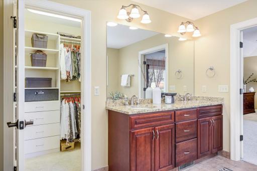The primary bath offers direct access to the adjacent walk-in closet.