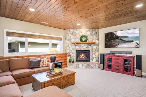 Just imagine movie night alongside this cozy fieldstone fireplace.