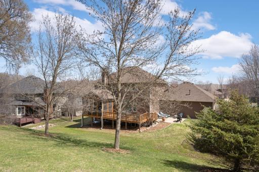 Amazing outdoor trifecta! Porch, deck, and stamped concrete patio.