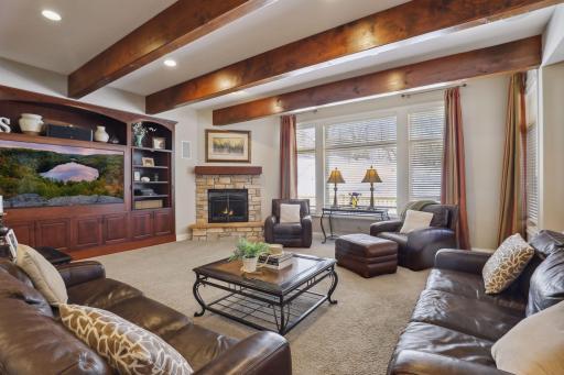 Rustic beams and beautiful custom cabinetry.