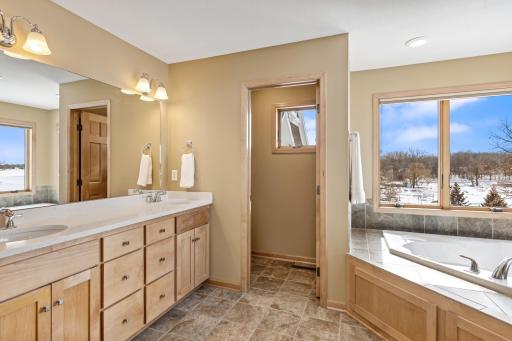 Primary private bath is like your own personal spa! The perfect spot to unwind and relax after a long day and soak the cares away in the oversized jetted tub.