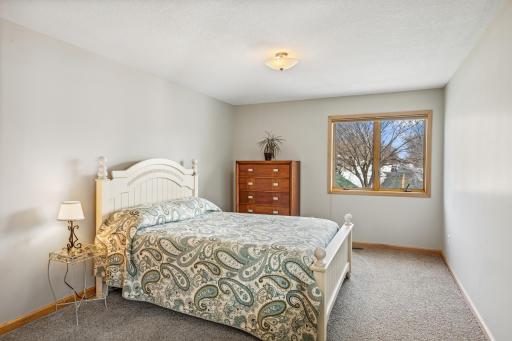 One of two additional bedrooms found on the upper level.