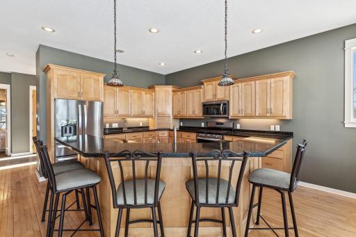 Grab a snack or a quick meal - room for 5 to sit at this lovely elevated counter.