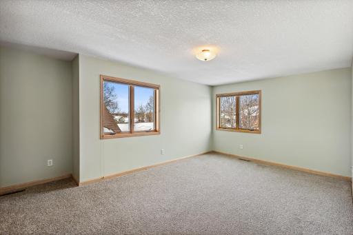 One of two additional bedrooms found on the upper level.