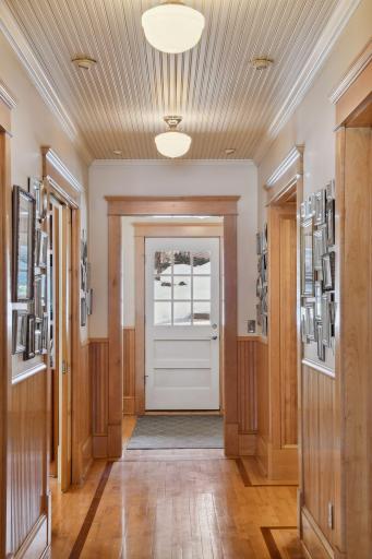 Oversized custom millwork throughout the home with bead board accents and maple inlay floors and oversized custom trim. The craftsman ship and attention to detail is evident throughout the home.