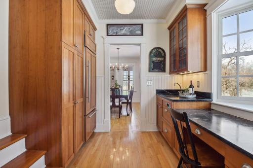 Additional Sub Zero fridge and freezer, and Fisher Paykel drawer dishwashers compliment the kitchen/butlers bar area and office. A second back stairway offers access to upper level bedrooms and laundry room