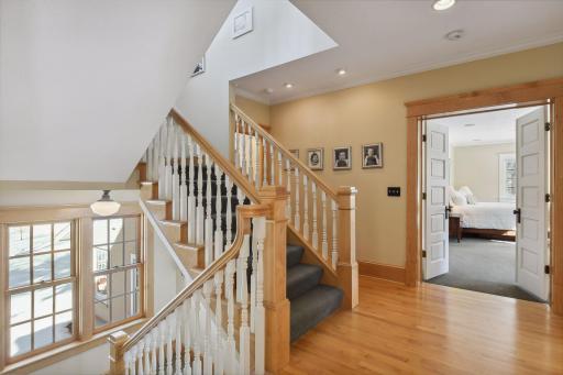 Custom spindles and oversized banister on this staircase deliver you to the second floor with 4 bedrooms, 3 baths and a large laundry room