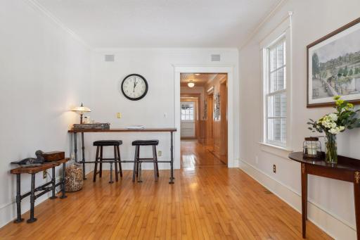 Living room, TV room, bar area...this space has so many options and offers perfect flow between the dining room , to the screened porch.