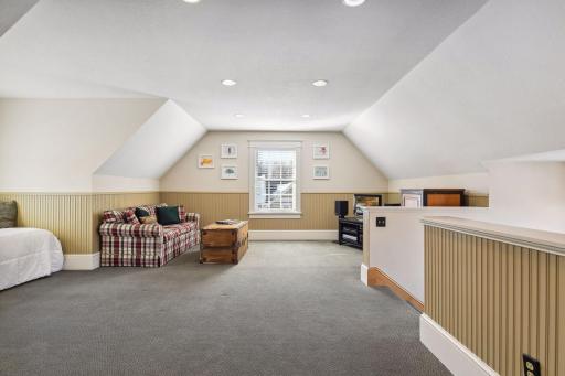 take a nap in the daybed nook or watch a movie in this large third floor family room