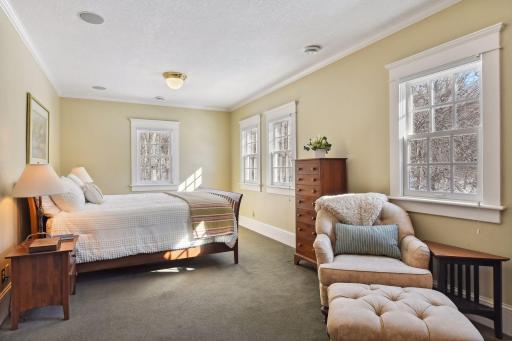 Large primary suite with nature views and plenty of light