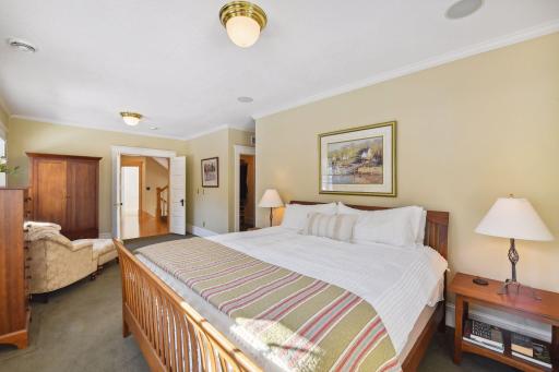 The primary suite offers sitting area, ensuite bath and full walk in closet