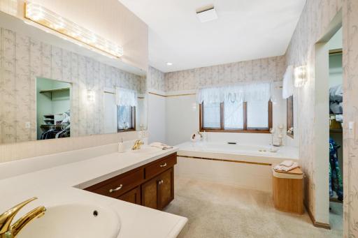 Master bathroom with dual sinks and extra cabinets
