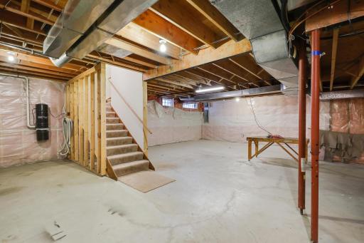 Unfinished basement is a blank slate and waiting for your design!