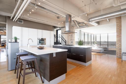 Dual kitchen islands, high end appliances, floor to ceiling windows