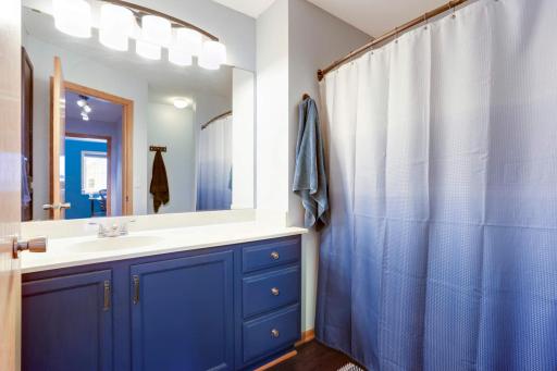 The upper-level full bath has an oversized vanity and linen closet.