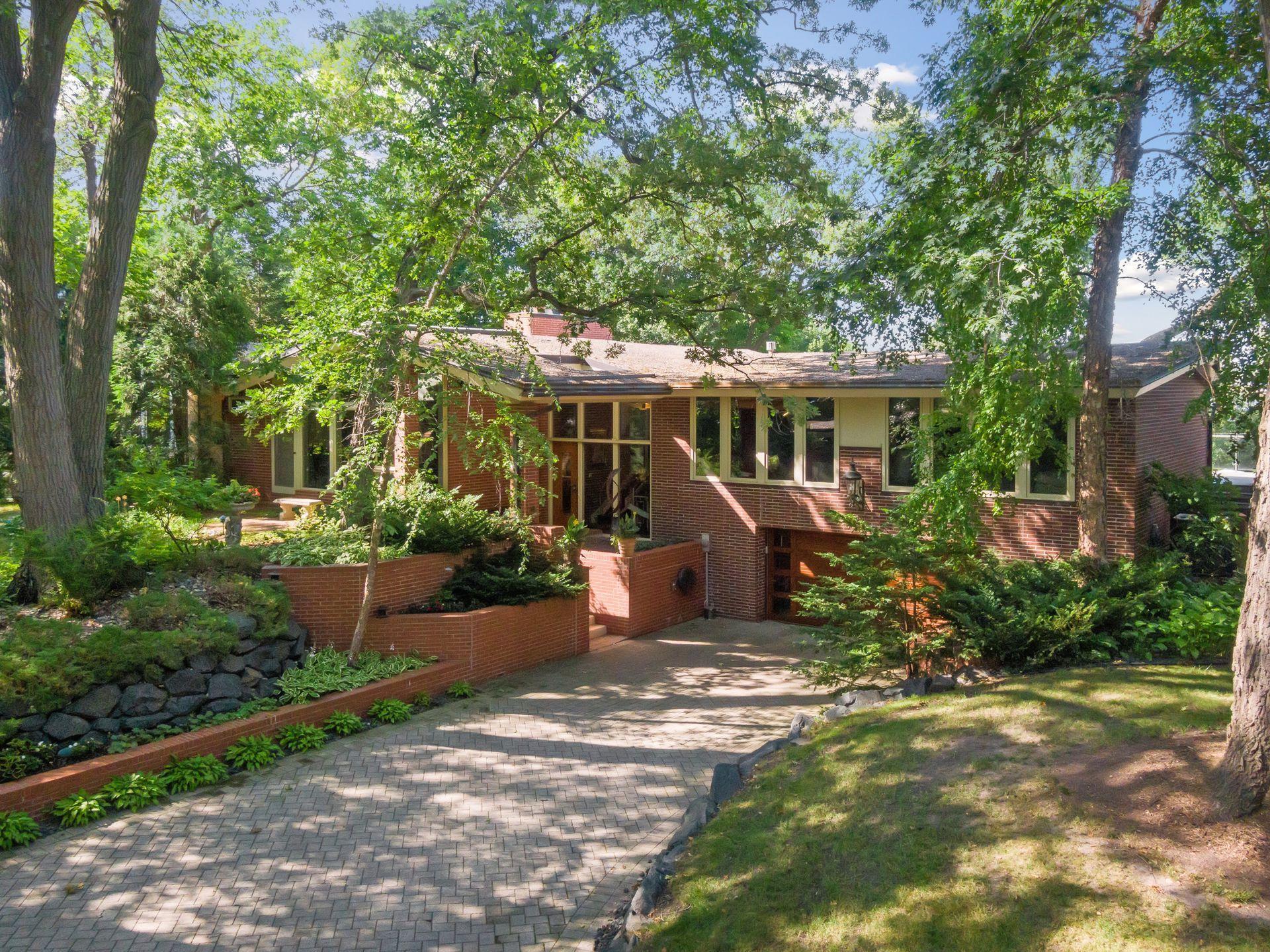 Home offers a two-car garage with large driveway that comes in handy when entertaining