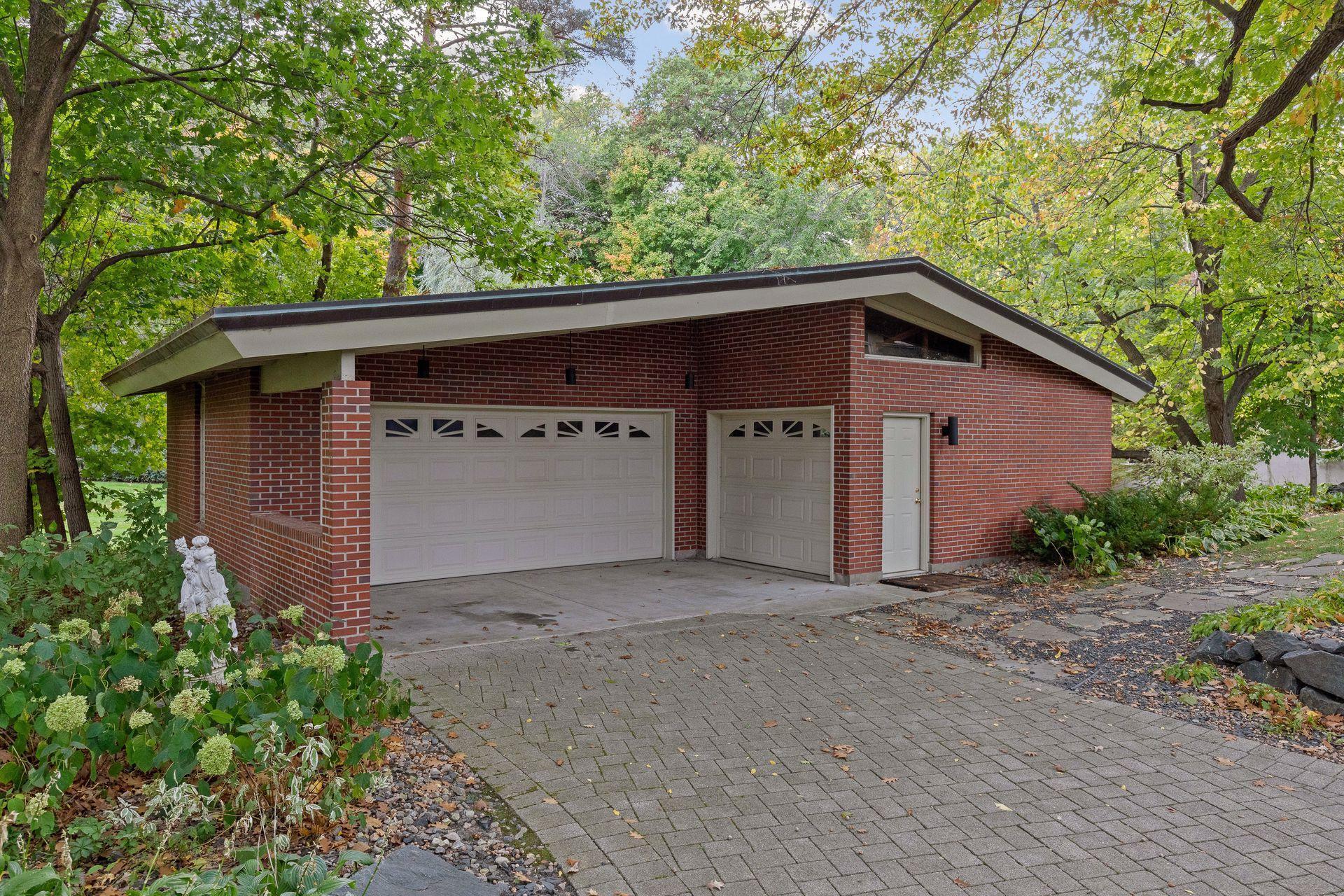A detached garage offers additional space for cars, yard equipment, seasonal toys, etc.