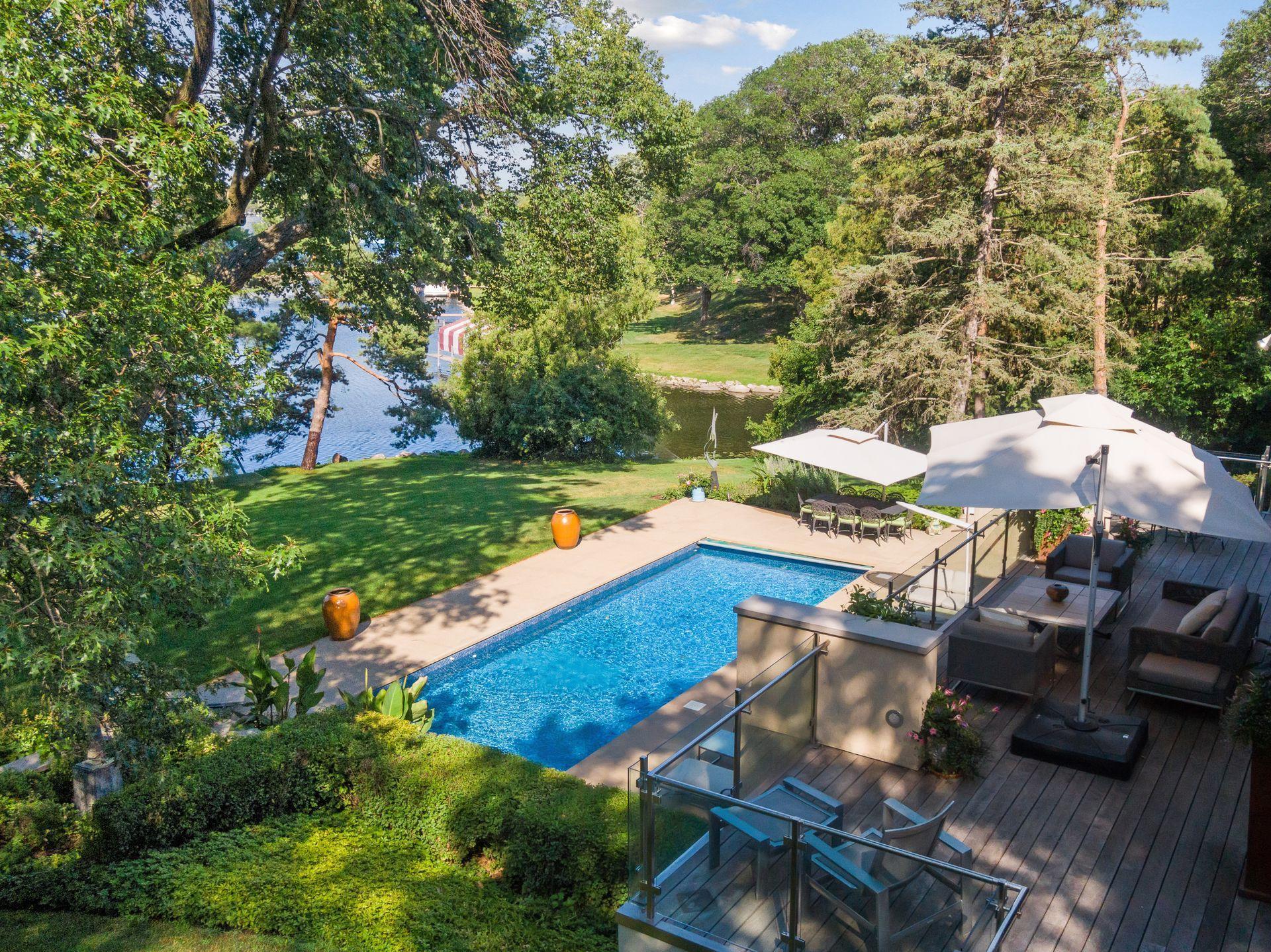 Lovely gardens and landscaping elevate the peaceful setting of this property