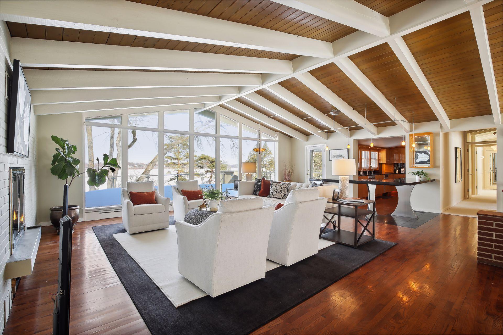 Gleaming hardwood floors, vaulted ceiling, gas fireplace and amazing lake views are highlights in the Great Room