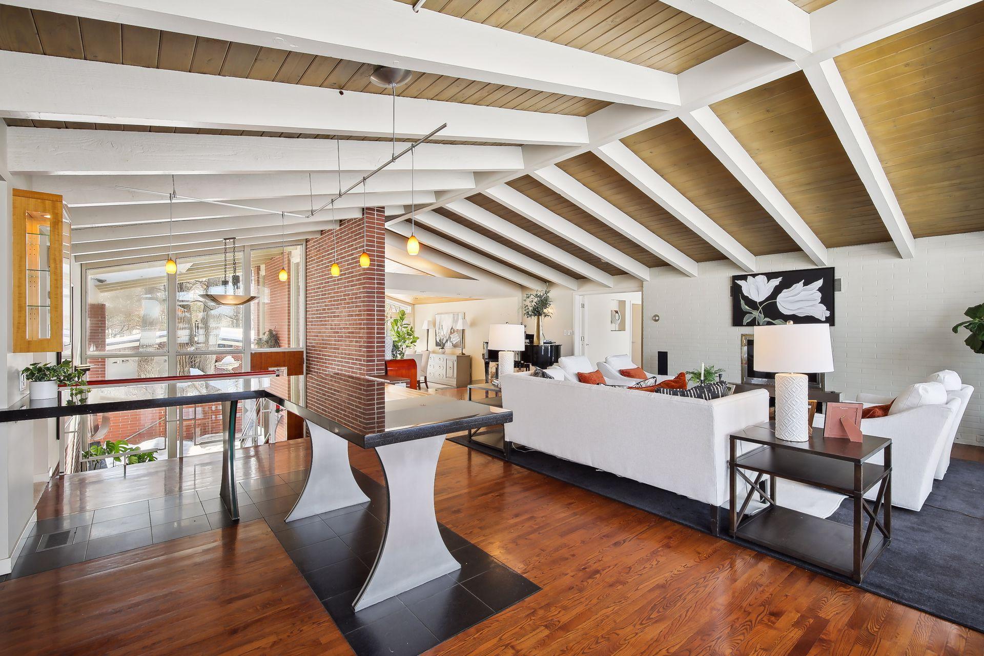 A unique custom dining counter just off the kitchen is perfect for casual meals and entertaining