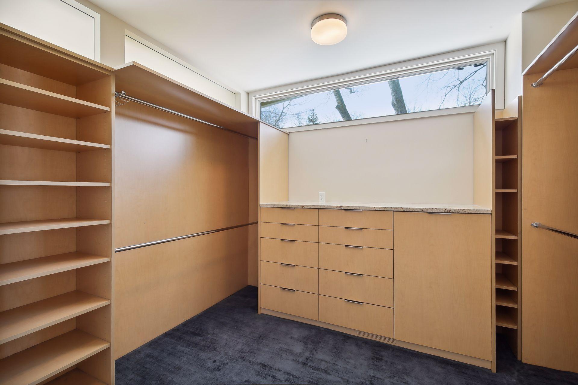 One of two walk-in closets located in the owner's suite