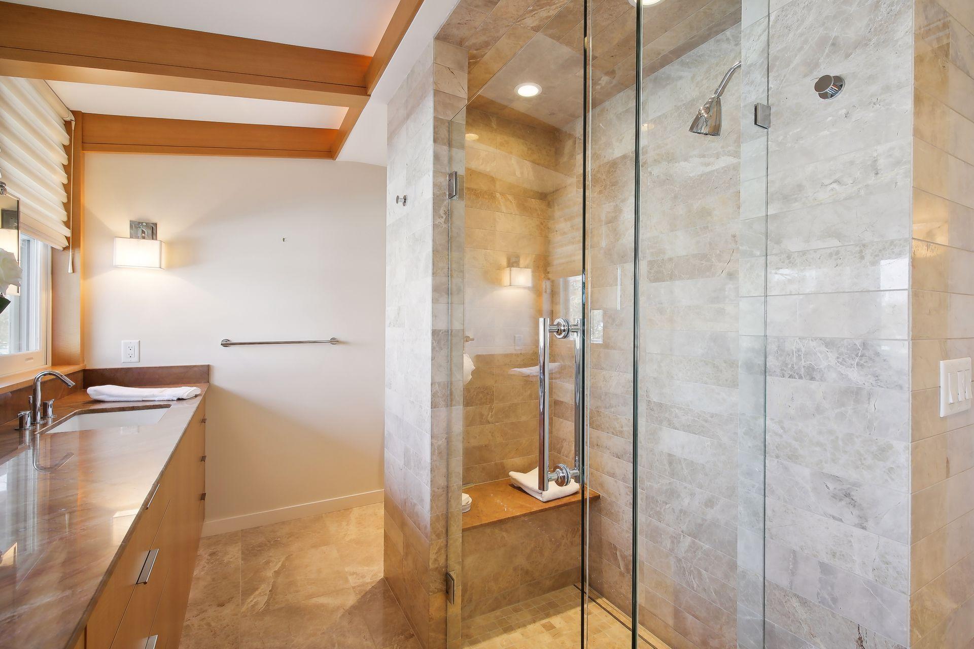 Bath with heated floors, dual sinks, and glass walk-in shower are found in this bath (ensuite to bedroom)