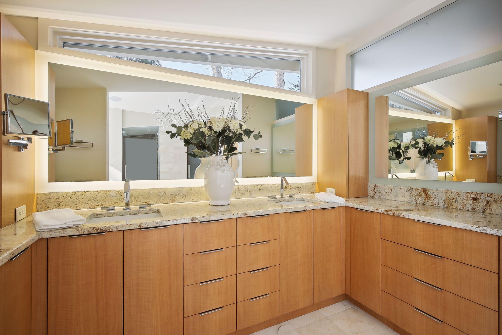 Dual vanity areas, lighted mirrors, and plenty of storage space