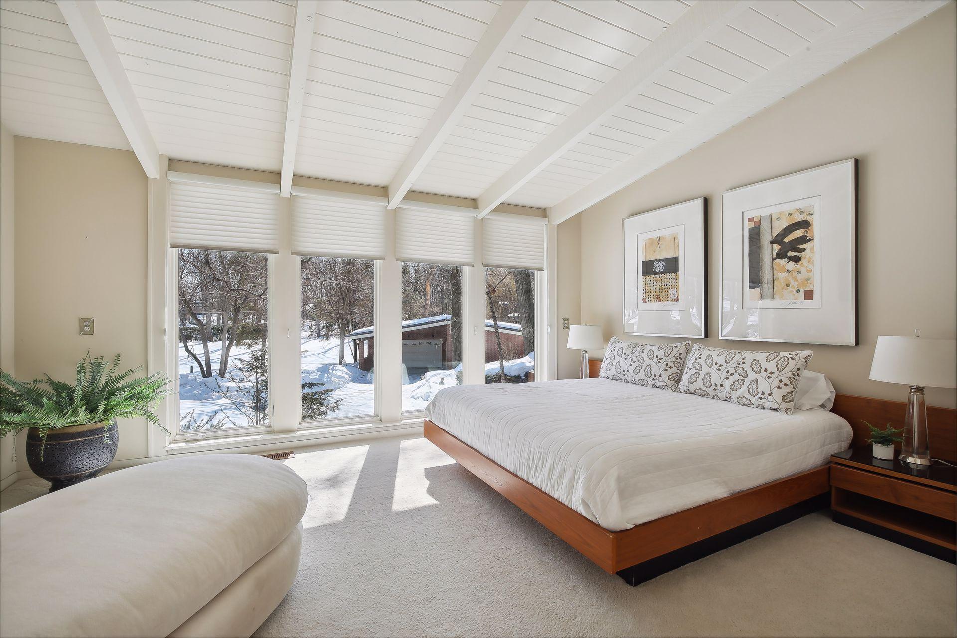 Located on the other end of the upper level is a secondary bedroom with views of the front yard