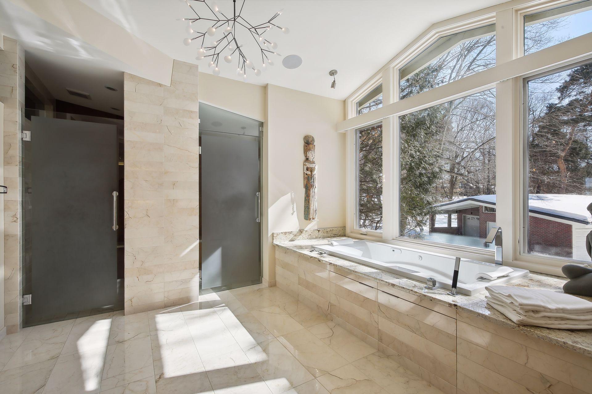 Frosted glass panels on the shower and water closet for privacy