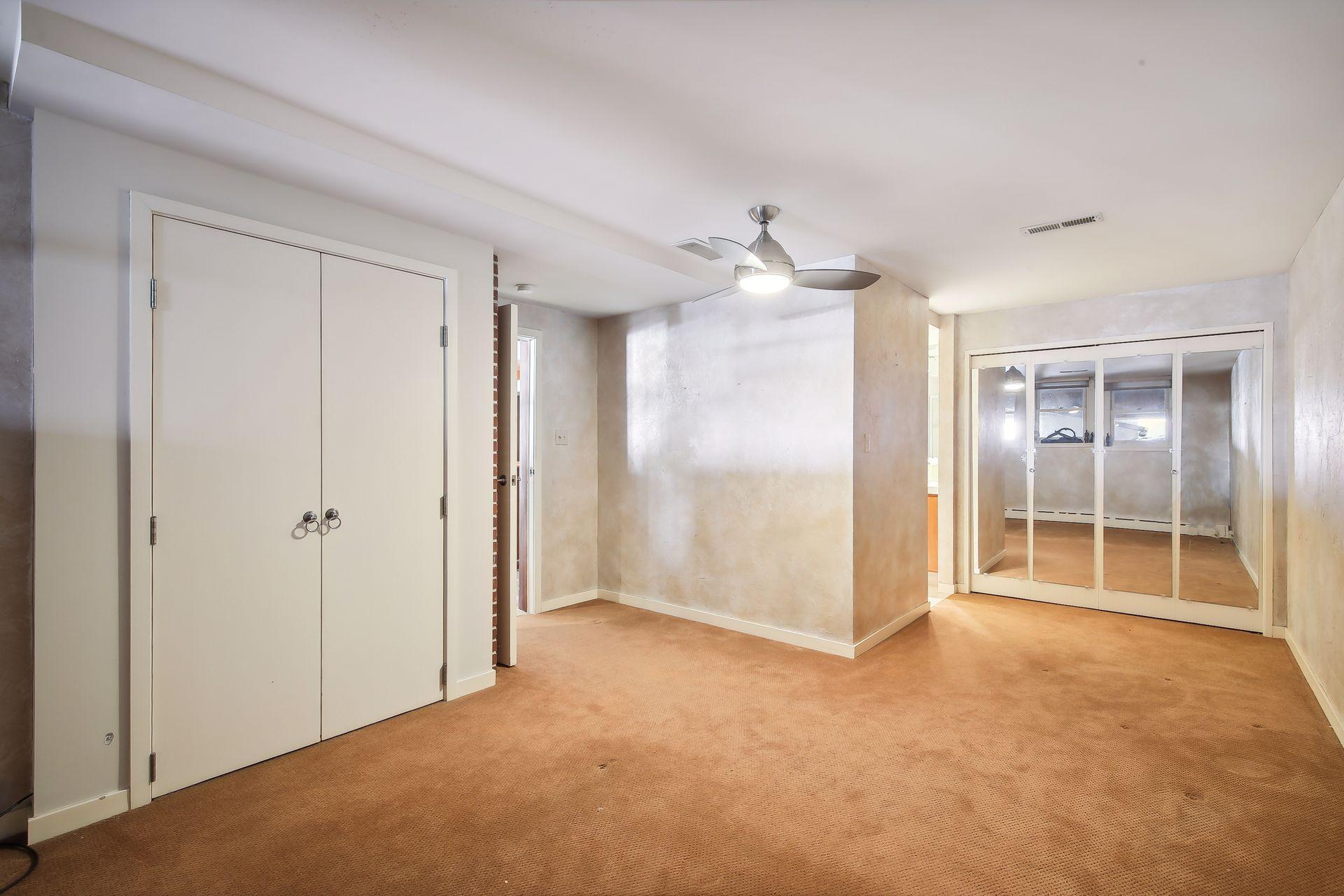 The home's third bedroom suite is found in the lower level and includes an ensuite bath