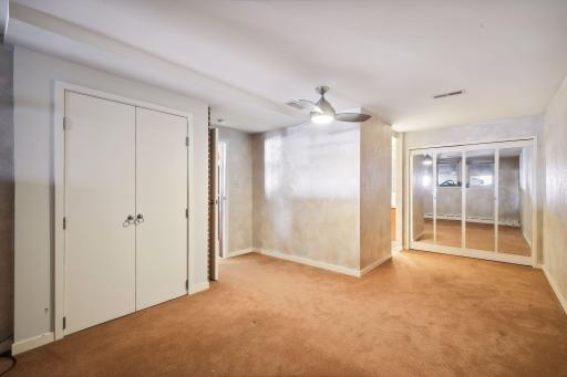 The home's third bedroom suite is found in the lower level and includes an ensuite bath