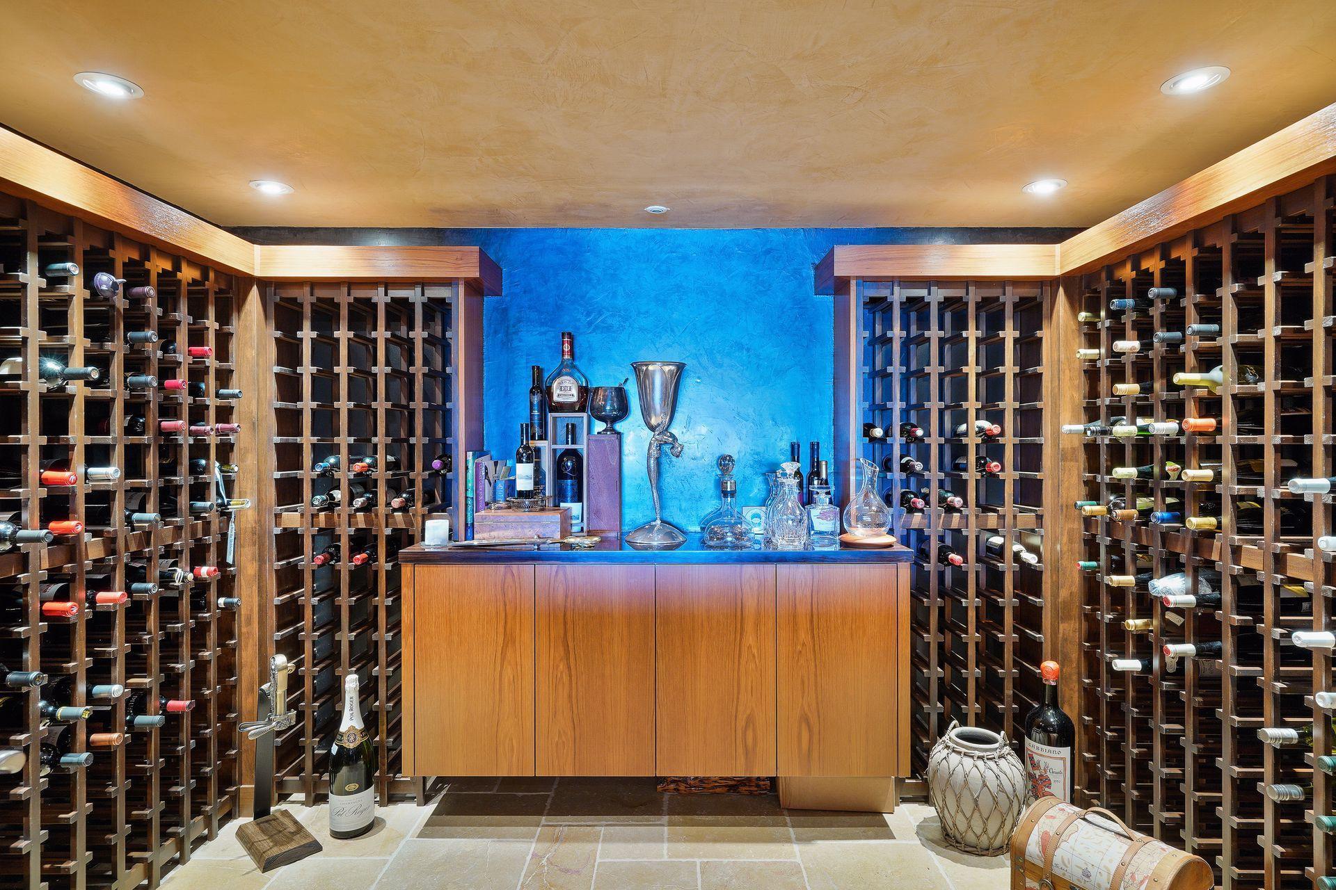 Wine aficionados will appreciate the wine cellar room and its multi-bottle storage