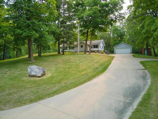 MAIN HOUSE AND GARAGE WITH CONCRETE DRIVEWAY