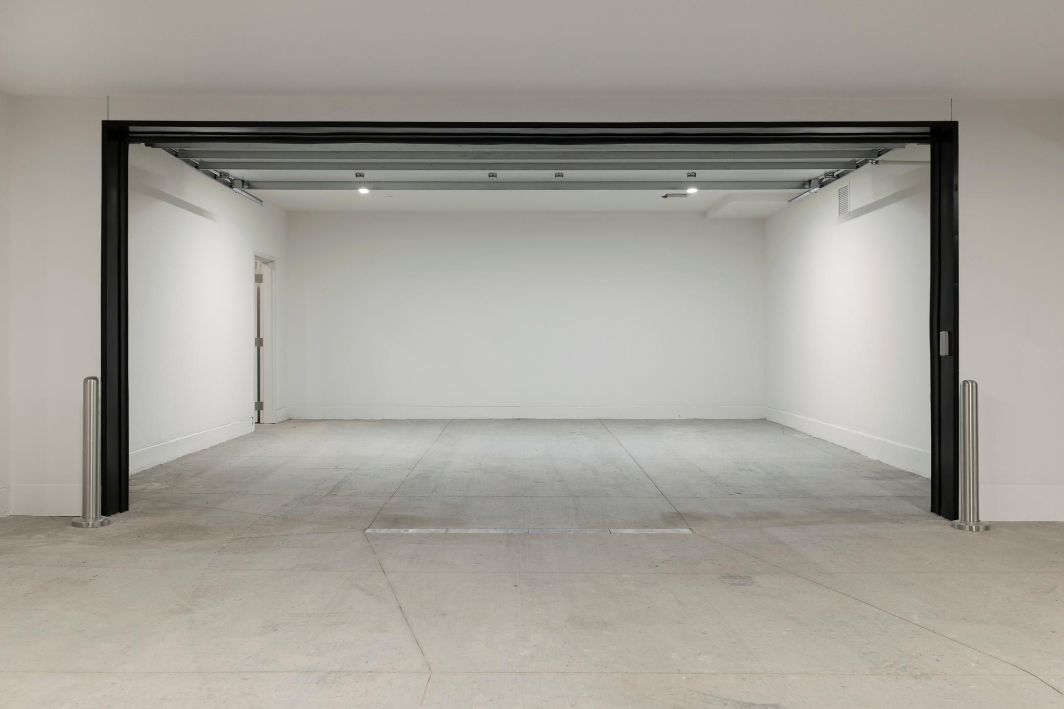 Photo of unit 202 double garage stall - 201 double stall is similar.