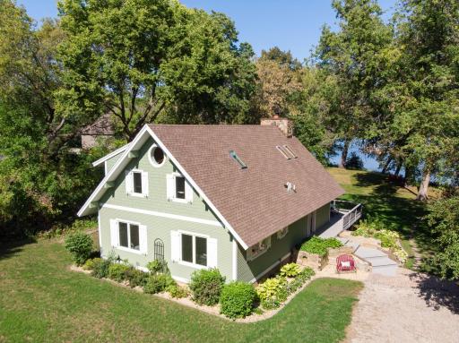 South view of Main House, complete remodel in 2017 w/new siding and most windows replaced with Marvin brand. Landscaping, land contour & drive reconfigured for drainage & erosion control!