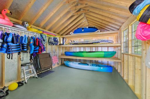 Interior view of brand new lakeside storage shed. Featuring kayak racks!