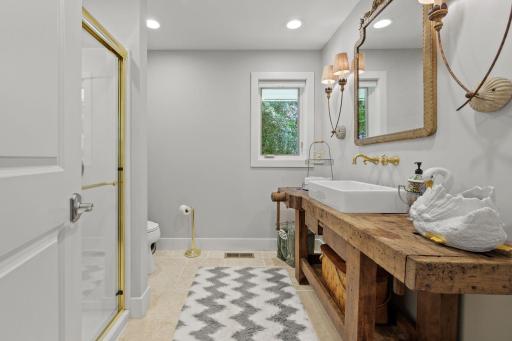 Main house bath; Travertine flooring hosting this French workbench w/German sink!