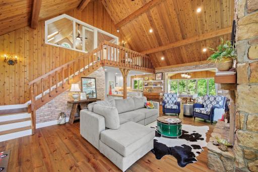 Whoa! Did we mention the beauty of the main house! Fireplace and amazing views of Lake Minnie Belle on your right, loft houses the master suite with full bathroom and laundry!