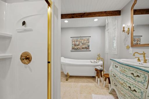 Master bath w/Travertine flooring, vintage vanity from Italy!