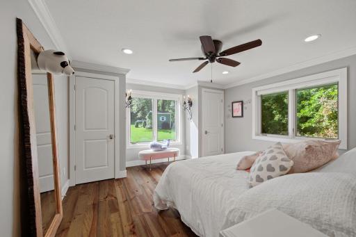 This bedroom in the main house has his/her closets and great natural lightening!