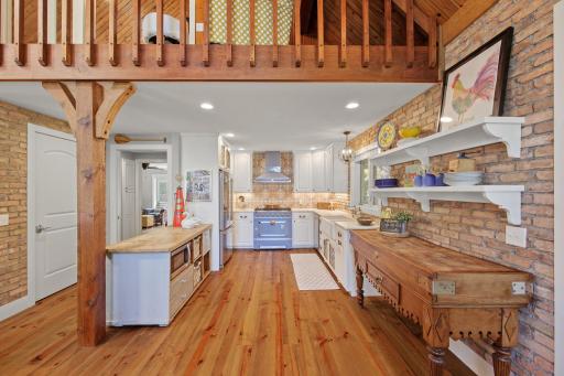 Two more pieces to treasure! The wooden counter on the right is an antique butcher block from Nimes, France; The blue island with the microwave on the left is an antique store counter from Sweden w/ a new butcher block top!