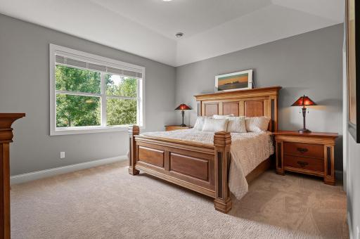 Primary bedroom is spacious enough for a king sized bed . Amazing peaceful views of the backyard.