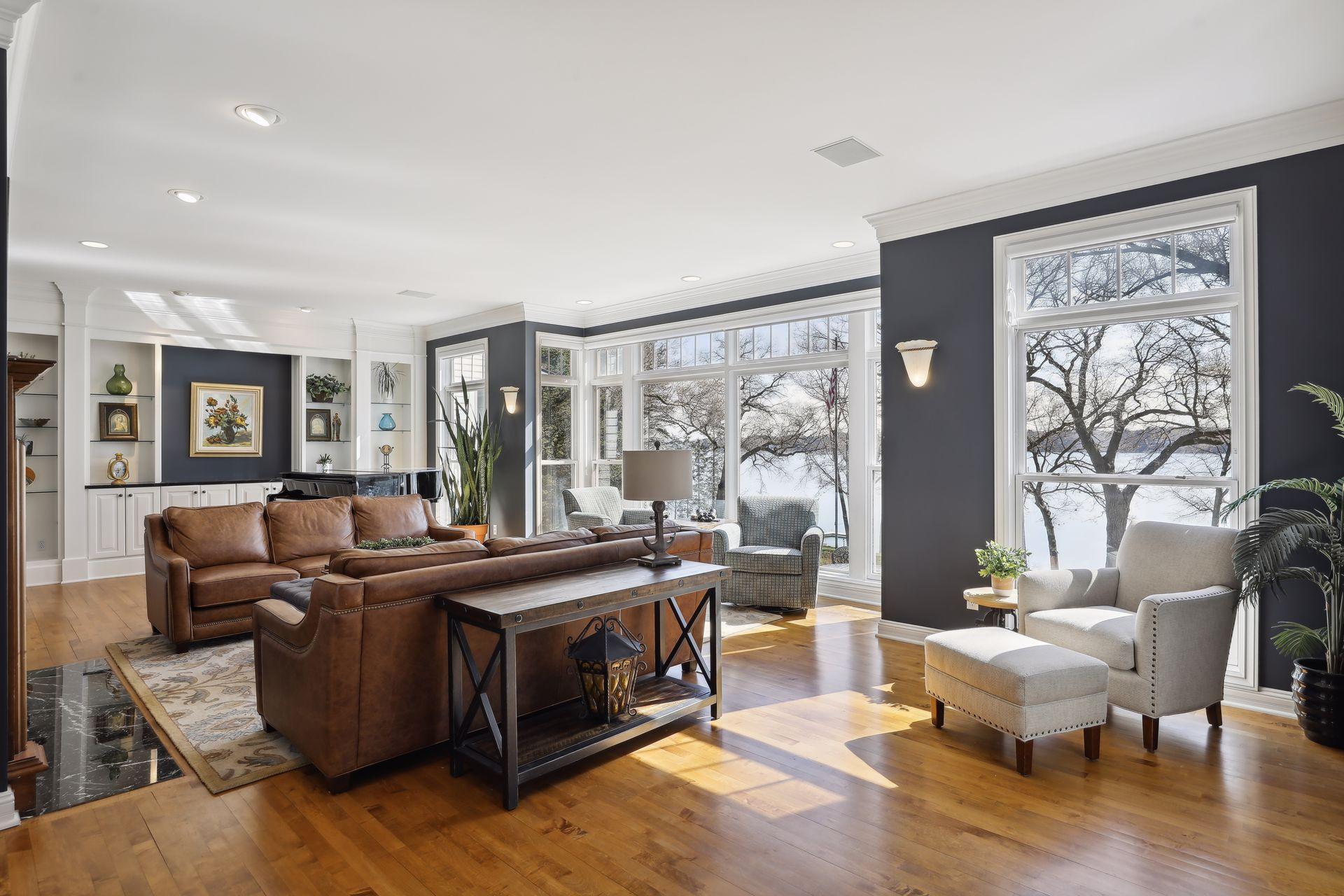 Living Room is surrounded by windows facing amazing lake views