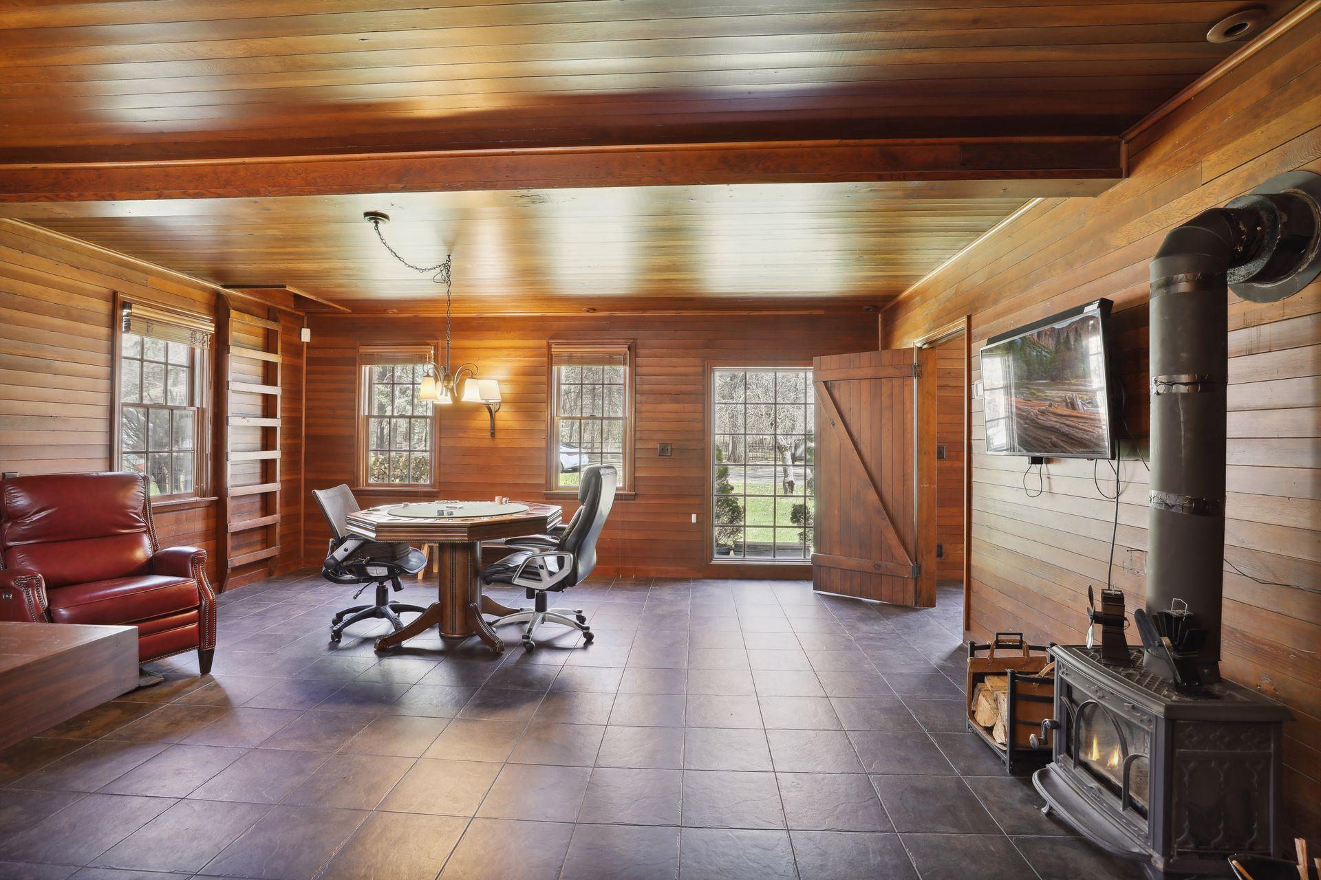 The Carriage House has been completely remodeled inside - featuring it's own private Bath and Kitchenette area. Extremely versatile, the Carriage House can serve as a Guest House, separate Office, 'Man-Cave' & more!